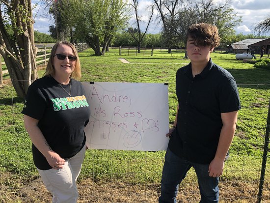 P.W. Engvall 6th grade teacher Suzanne Ross and her student Andre Johnson on Sunday at Johnson's home on the outskirts of Lemoore.